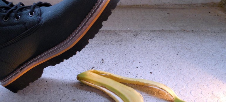 A person stepping on a banana peel.