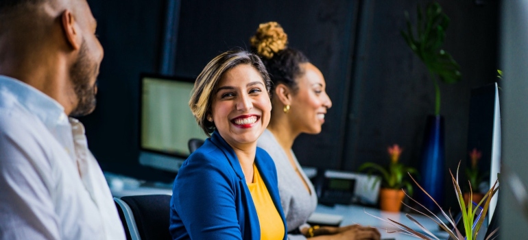 A smiling woman in a workplace