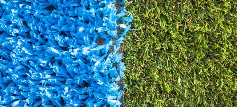 A split between artificial turfs, showing one of the benefits of artificial grass for sports facilities.
