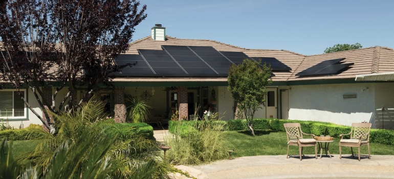 A modern house with a solar array.