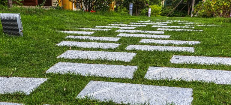 pavers surrounded by artifical grass