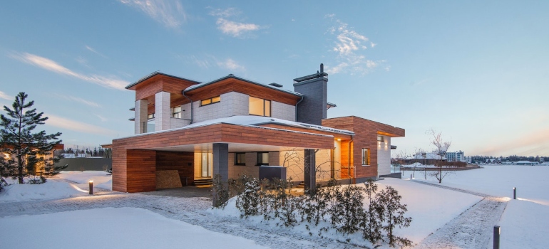 A modern cottage in the snow