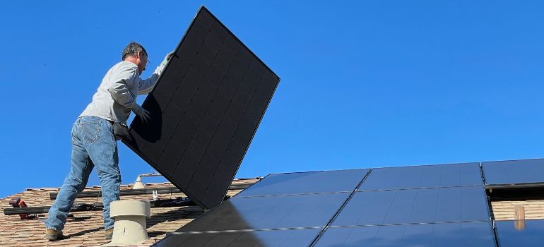 man holding a solar panel in Nevada