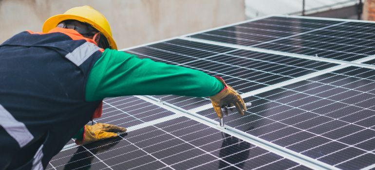 man installing solar panels on a Nevada home