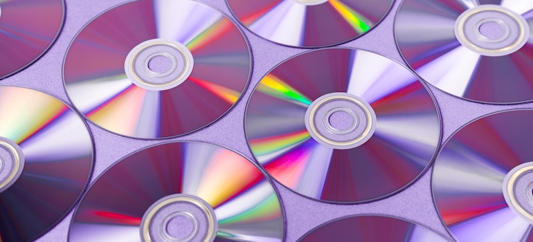 Several CDs placed next to each other on the surface.