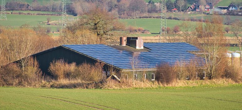 A countryside house with solar panels.