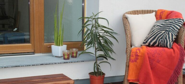 Balcony with chair, plants and candles