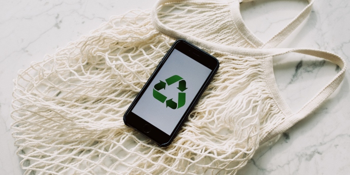 iphone with sustainability logo 