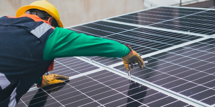 a man installing solar panels