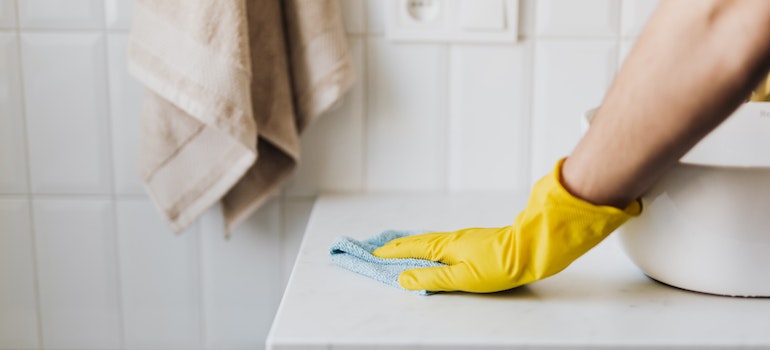 A person cleaning bathroom 