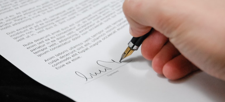 A person signing contract