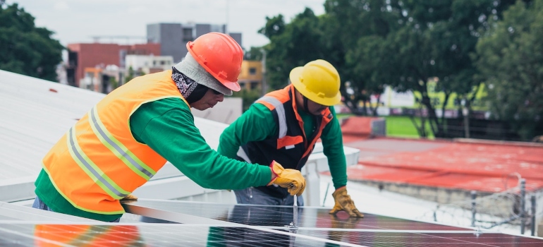 solar technicians installing solar panels 