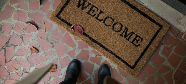 The doormat and persons feet 